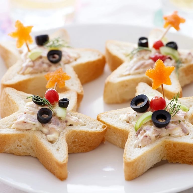 Brightly colored Mini Starfish Sandwiches, ready to serve and full of delicious tuna flavor.